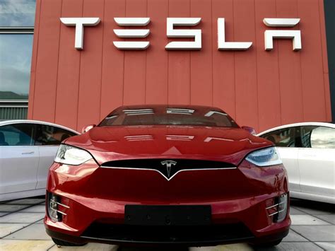 After 4 US price cuts, Tesla raises cost for older models